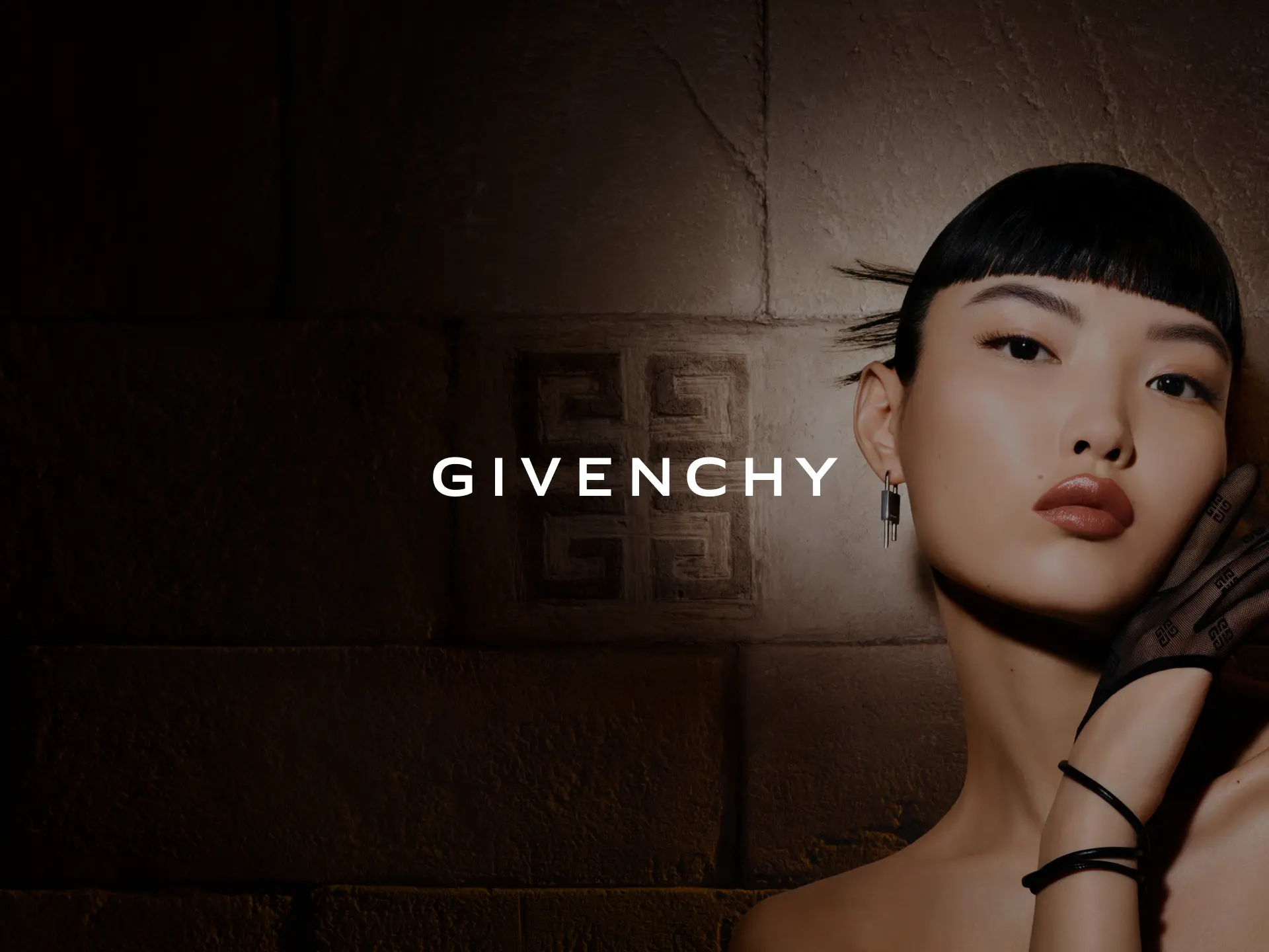 Givenchy logo with a photo from the Interdit Absolu campaign